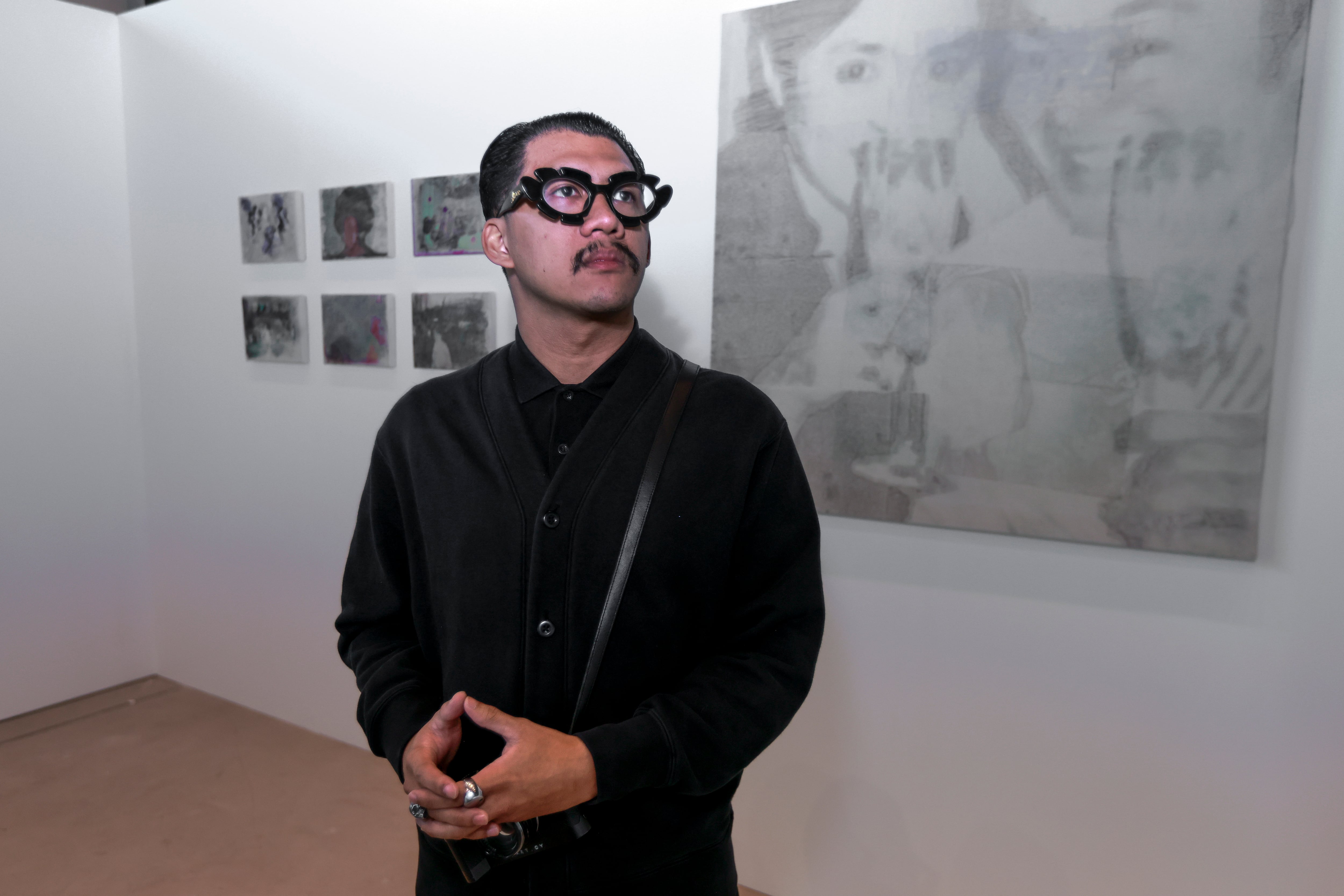 Martin Ong Yambao incorporates found photographs and the Filipino healing ritual of pagtatawas into works exploring memory, loss and preservation. Victor Besa / The National