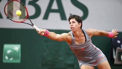Carla Suarez Navarro of Spain plays a shot to Monica Niculescu of Romania during their women's singles match at the French Open tennis tournament at the Roland Garros stadium in Paris, France, May 25, 2015. REUTERS/Vincent Kessler