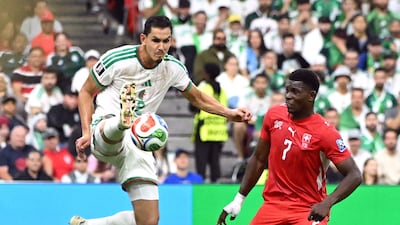 Algeria defender Aissa Mandi challenges for the ball alongside Switzerland goalscorer Breel Embolo in Vancouver. Reuters