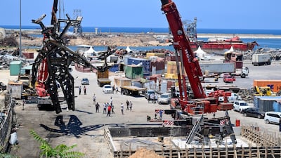 Workers install a monument inside Beirut port as a remembrance for the victims of the August 4 port blast in Beirut, Lebanon, July 27, 2021. EPA