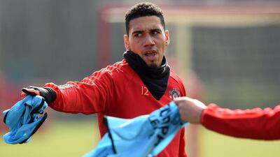 Manchester United’s English defender Chris Smalling takes part in a team training session at their Carrington Training Centre in Manchester, north west England on March 16, 2016 ahead of their Uefa Europa League second leg football match against Liverpool. AFP / Paul ELLIS