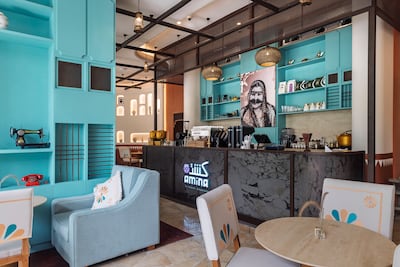 A painting of Almansoori’s mother Amina hangs in the restaurant. Antonie Robertson / The National