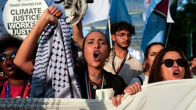 Activists take part in a demonstration for climate justice and a ceasefire in Gaza at Cop28 on Saturday. AP