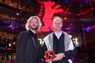 French director Guillaume Cailleau and American director Ben Russell with the Encounters Best Film Award for Direct Action. Reuters