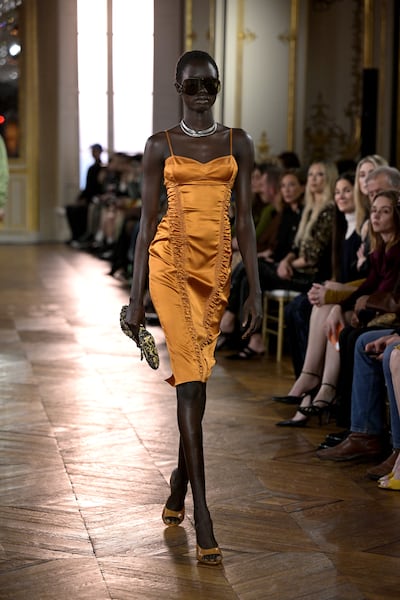 Antonin Tron reworks mid-century silhouettes with wet-look fabrics, animal prints and body-skimming cuts. Getty Images