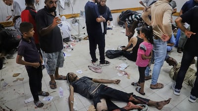 Palestinians wounded while trying to reach aid lorries entering Gaza through the Morag corridor receive treatment at Nasser Hospital. AP