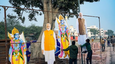 Workers put up cutouts of Hindu deity Ram and Indian Prime Minister Narendra Modi in Ayodhya, India. AP Photo