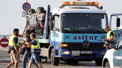 The car on a tow truck is seen where the police investigate the scene of an attack in Cambrils, south of Barcelona, Spain, August 18, 2017. REUTERS/Stringer NO RESALES. NO ARCHIVES