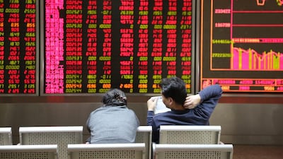 China’s decision to weaken its currency pushed the Shanghai Composite back into positive territory, closing up 2.25 per cent, on Wednesday. ChinaFotoPress / Getty Images