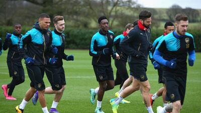 ST ALBANS, ENGLAND - FEBRUARY 22: Danny Welbeck (C) of Arsenal warms up with team mates during the Arsenal training session ahead of the UEFA Champions League match against Barcelona at London Colney on February 22, 2016 in St Albans, United Kingdom. (Photo by Matthew Lewis/Getty Images)