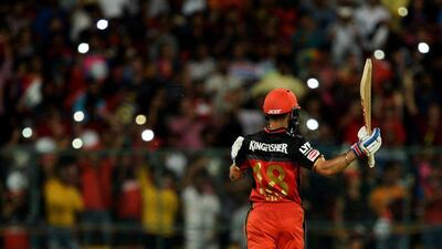 Royal Challengers Bangalore captain and batsman Virat Kohli celebrates hitting a century in his team's IPL win on Saturday. Manjunath Kiran / AFP / May 7, 2016