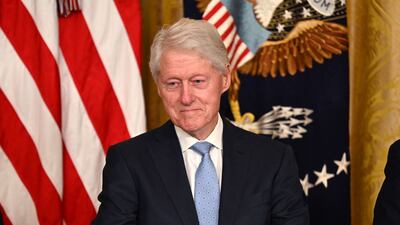 Mr Clinton's law entitles eligible employees of covered employers to take unpaid, job-protected leave for specified family and medical reasons, with continued insurance cover. AFP