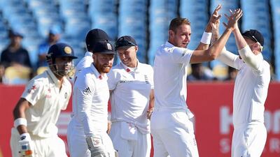 England's Stuart Broad, second right, celebrates with teammates after taking the wicket of India's Gautam Gambhir, left, on the third day of the first Test match at the Saurashtra Cricket Association Stadium in Rajkot on November 11, 2016. Indranil Mukherjee / AFP