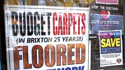 Messages supporting Brixton Arches in a shop window. The landlord Network Rail's plan to convert them is likely to take a year. Dan Kitwood / Getty