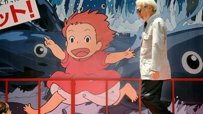 "I'm struggling desperately to create something better." Hayao Miyazaki walks past an advertisement for his most recent film, Ponyo on the Cliff by the Sea.