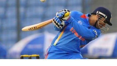 Virender Sehwag fends off a bouncer on his way to scoring 175 yesterday. Munir uz Zaman / AFP