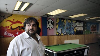 Hanif Qadir, a former extremist who now runs the Active Change Foundation, at the now closed youth centre in east London in 2011 following government funding cuts. (AP Photo/Lefteris Pitarakis)