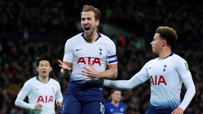 Tottenham's Harry Kane celebrates scoring their first goal with teammates. Reuters