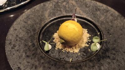 Lemon sorbet and meringue mousse in a white chocolate shell at The Grill