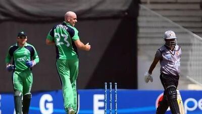 Ireland's Trent Johnson, right, rejoices after dismissing UAE's Swapnil Patil during the second ODI match at the Sharjah Cricket Stadium. Satish Kumar / The National