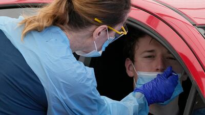 A swab is administered at a drive-through Covid-19 testing clinic at Bondi Beach, Sydney. AP
