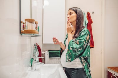 With fluctuating hormones and different sensitivities, women may want to adapt their skincare routine throughout their pregnancies. Getty Images