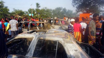 Cars were severely damaged in the explosion. AFP