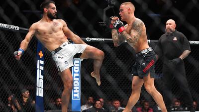 Benoit Saint Denis, left, in action against Dustin Poirier during their lightweight bout at UFC 299. AFP