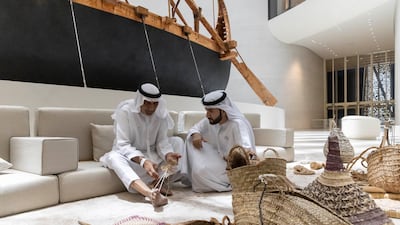 A palm-frond weaving demonstration during Zayed National Museum's World Environment Day programme. Antonie Robertson / The National
