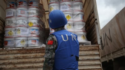 A Chinese UN soldier prepares a lorryload of Ebola relief aid, in Harbel, Liberia in 2014. Getty Images