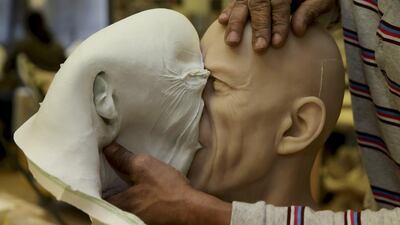 The figure is prepared ahead of the opening of the new Grevin Wax Museum in Prague on May 1st. Philippe Wojazer / Reuters