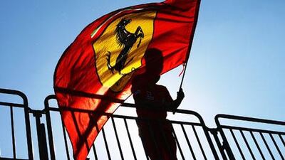 A Ferrari fan is seen in the grandstand during a practice session ahead of the Italian Grand Prix in Monza. The entire region, in this part of Italy, metamorphoses into a sea of scuderia red on the weekend.