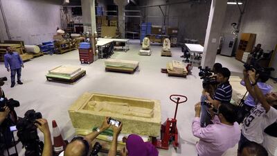 Cameramen film the stone laboratory of the restoration center at the partially opened complex of the Grand Egyptian Museum in Cairo. Amr Nabil / AP Photo
