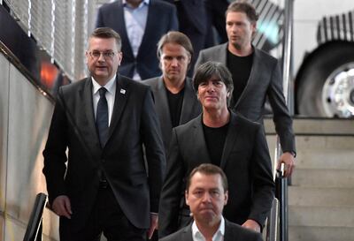 DFB president Reinhard Grindel, left, and manager Joachim Low, right, have a problem on their hands. AP Photo