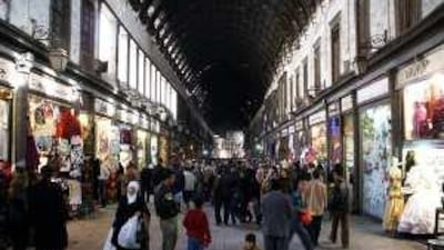 Free wheeling: shoppers at the ancient Hamidiyeh market in Damascus, Syria. Money changers are now leading the charge to modernise, even setting up banks.