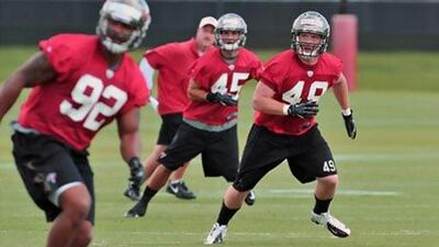 Joe Holland, right, and the rest of the Tampa Bay Buccaneers' rookies who got through mini-camp in May return with the veterans to prepare for the upcoming 2013/14 season.