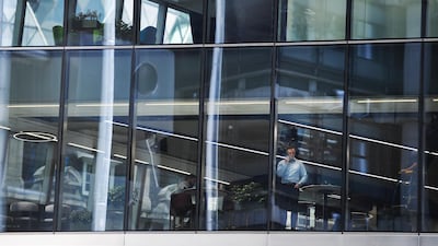 Workers in an almost empty office building in the City of London earlier this month. Big Four accountancy firm PwC expects most of its UK staff to continue working remotely even after the pandemic has lifted. Housebuilder Taylor Wimpey is considering changing the layout of homes to factor in increased home working. EPA
