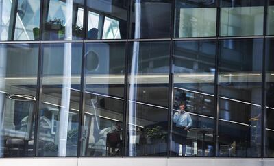 Workers in an almost empty office building in the City of London earlier this month. Big Four accountancy firm PwC expects most of its UK staff to continue working remotely even after the pandemic has lifted. EPA