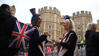 Royal supporters get into position outside of Windsor Castle ahead of the Royal wedding of Princess Eugenie of York and Mr Jack Brooksbank at St. George's Chapel in Windsor, England. Getty Images
