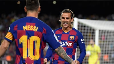 Barcelona's French forward Antoine Griezmann is congratulated by teammate Lionel Messi after scoring the first goal against Villarreal. AFP
