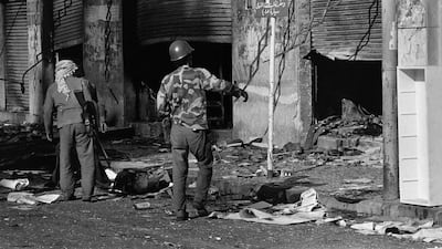 An armed man stands in a street in Lebanon's northern city of Tripoli, on October 21, 1975. The military had taken up positions in the buffer zone between Sunni-majority Tripoli and Zgharta, with orders to keep fighters from the cities apart.
