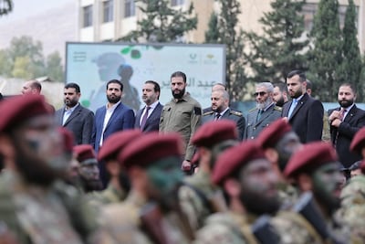 Syria's President Ahmad Al Shara and Foreign Minister Asaad Al Shibani watching a military parade in Damascus. AFP