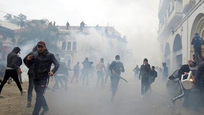 People clash with anti-riot police during the protest against President Abdelaziz Bouteflika, in Algiers, Algeria. Reuters