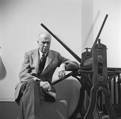 circa 1955: American realist painter, Edward Hopper (1882-1967) sitting by a manual printing press in his Greenwich Village studio. Three Lions / Getty Images