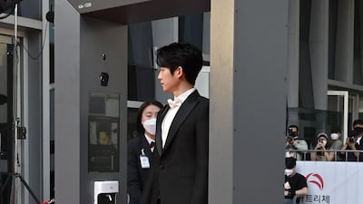 Actor Jung Hae-in walks through a thermal camera system. AFP