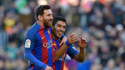 Barcelona’s Lionel Messi and Luis Suarez celebrate against Las Palmas. Luis Gene / AFP