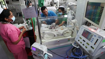 Dr Saman Kumara, consultant neonatologist, with staff at the Castle Street Hospital for Women in Colombo. Lahiru Harshana for The National.
