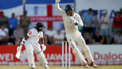 England's wicketkeeper Ben Foakes celebrates after taking a catch to dismiss Sri Lanka's Akila Dananjaya. Reuters