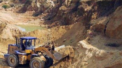 A worker drives a skip loader while working at the site of a rare earth metals mine at Nancheng county, Jiangxi province. China's Commerce Ministry said in December that it would not issue more export quotas for foreign companies as it did last year and the first set of volume totalling 14,446 included those for foreign firms.