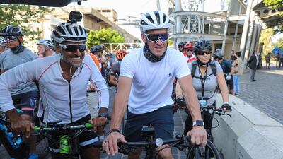 US former professional cyclist Lance Armstrong along with Lebanese sportsman Maxime Chaya prepare to lead "Bike for Beirut" charity tour at the site of the August 4 port explosion. AFP